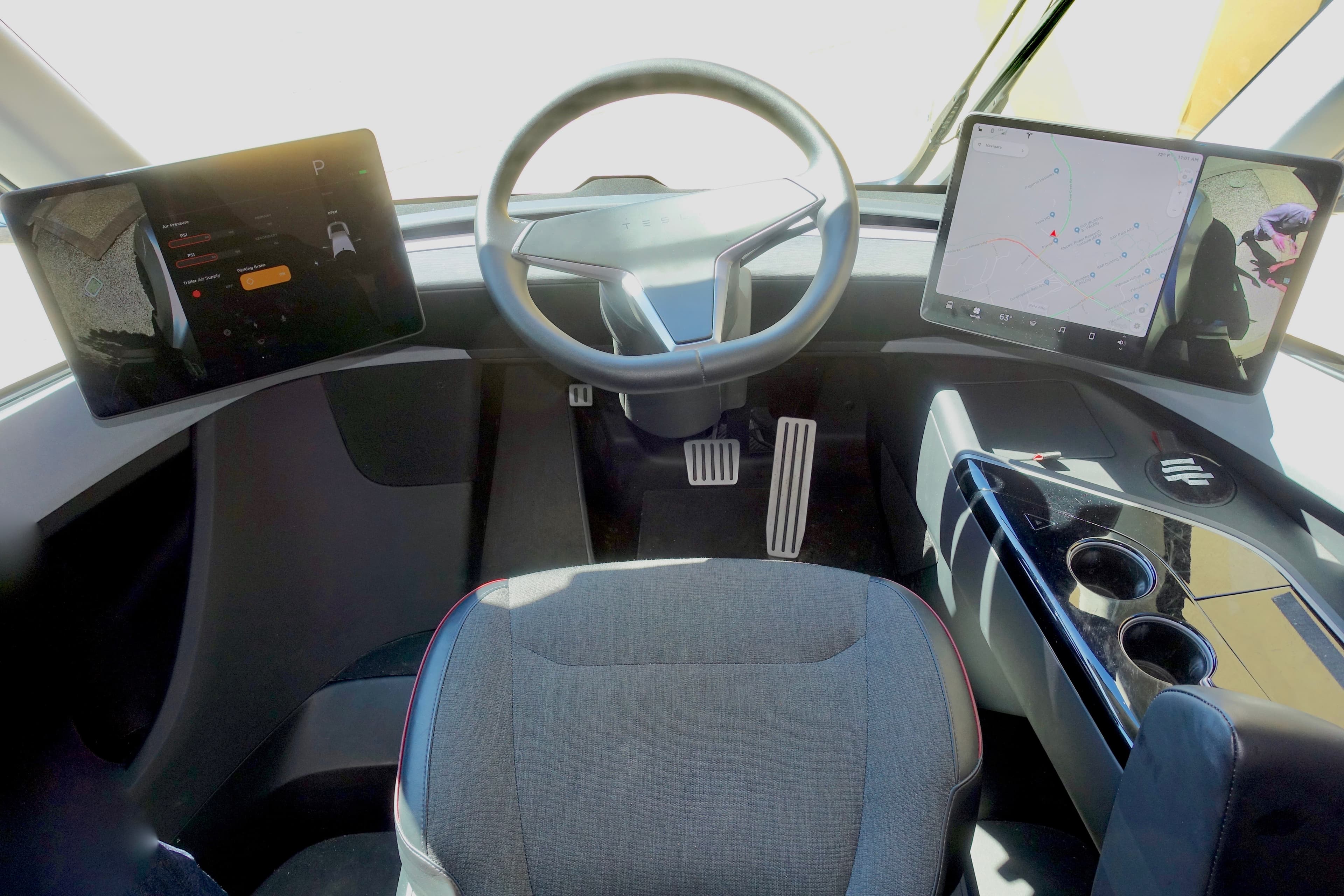 Tesla Semi cockpit with center seat and dual displays